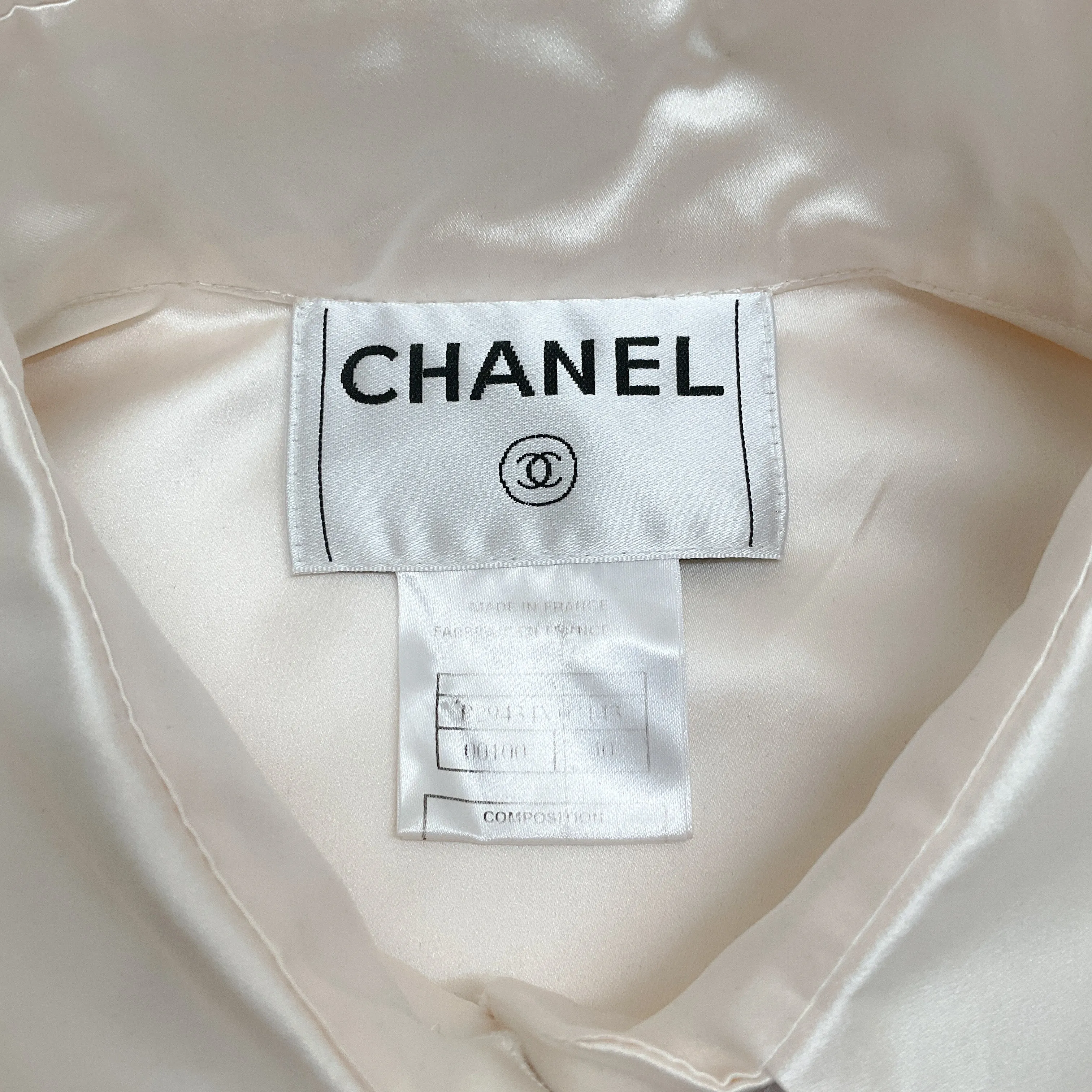 Chanel Ivory Silk Sleeveless Blouse with Black Tie Neck